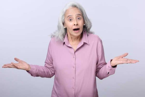 Photo of woman shrugging her shoulders