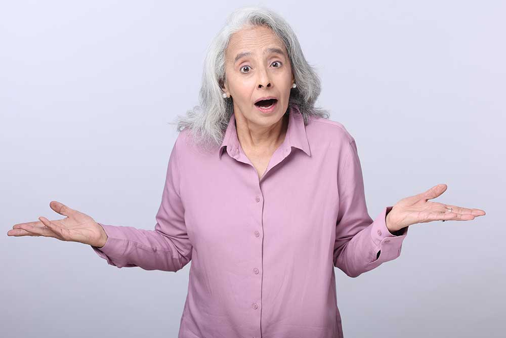 Photo of woman shrugging her shoulders