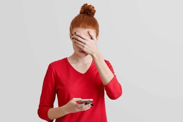Photo of woman looking at cell phone