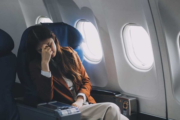Photo of woman in airplane
